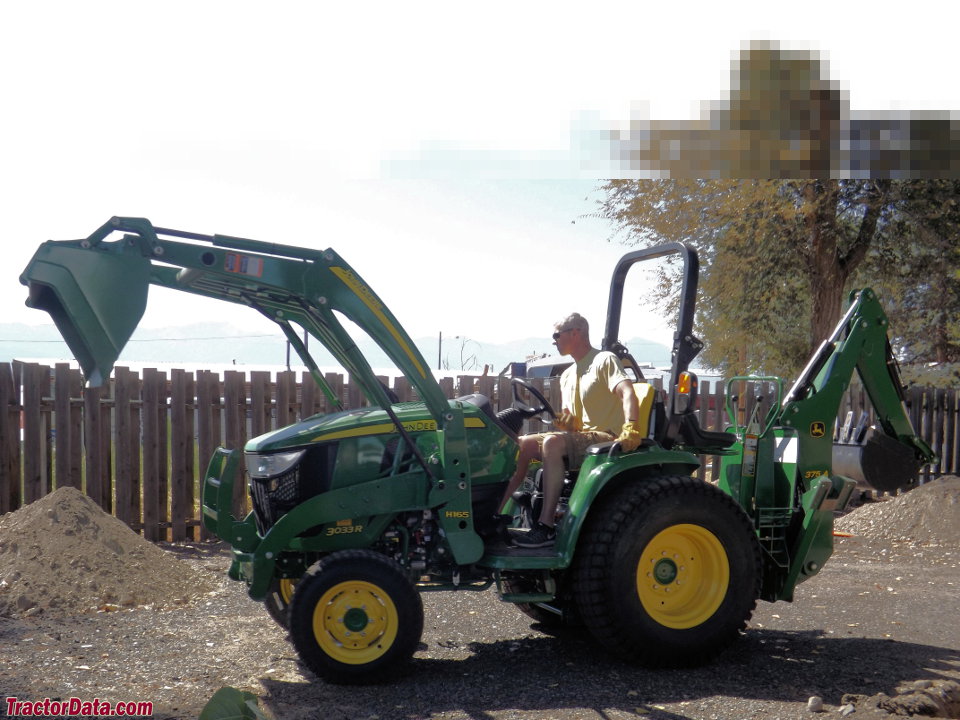 John Deere 3033R with loader and backhoe.