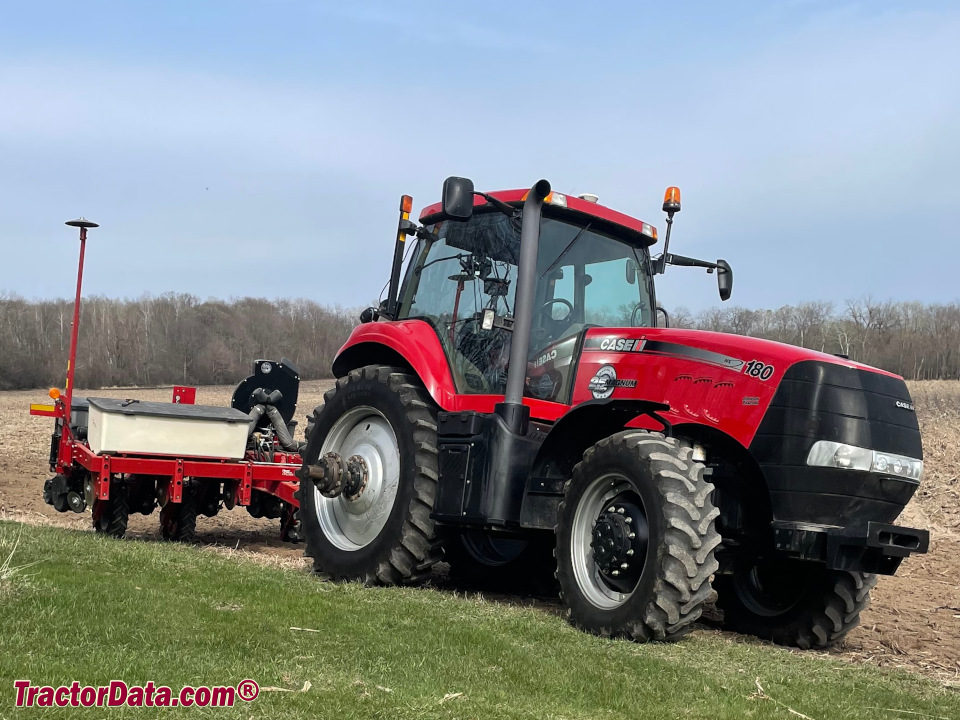 Twenty-fifth anniversary Case IH Magnum 180 row-crop tractor with planter, left side.