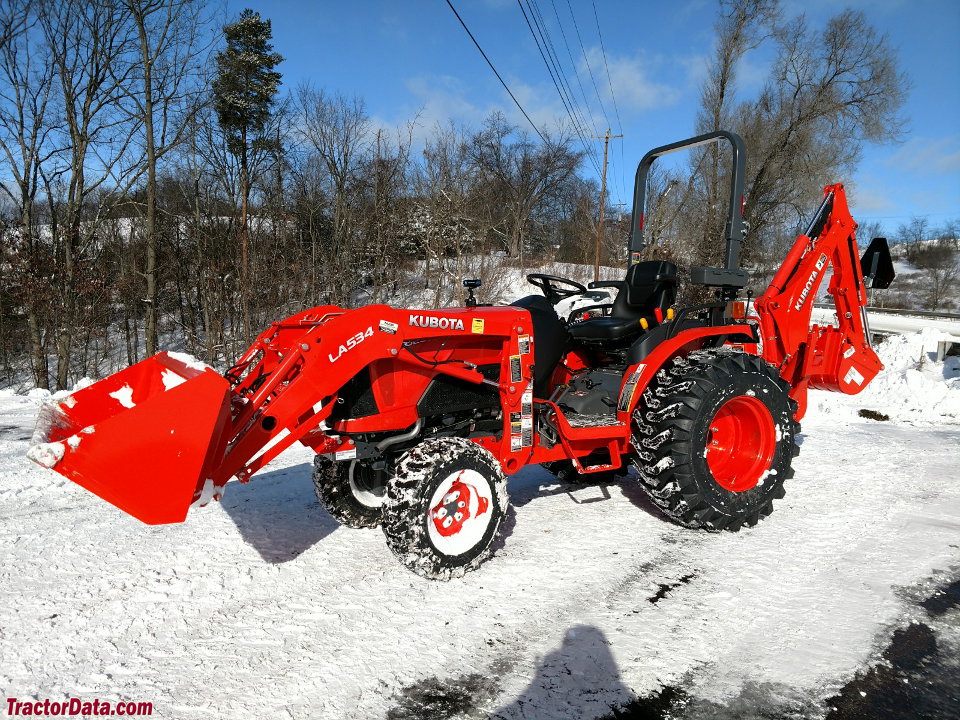 Kubota B2650 with loader and backhoe, left side.