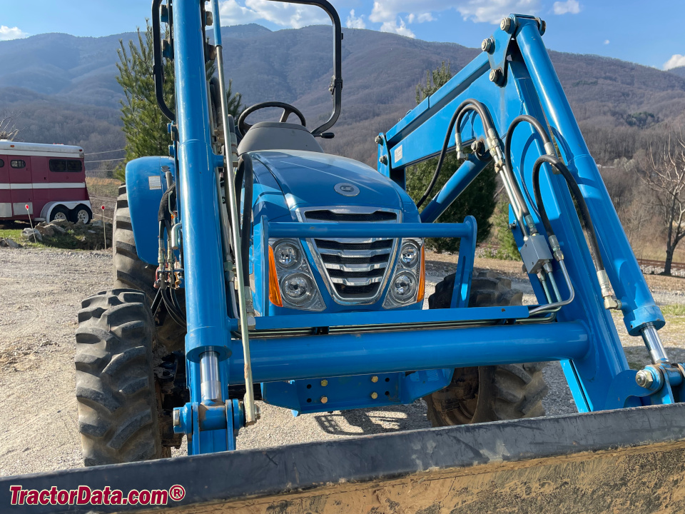 Two Farmhand 100 tractors with a Farm Handy utility vehicle.