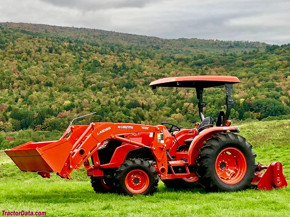 Kubota MX4800 with LA1065 front-end loader, left side.