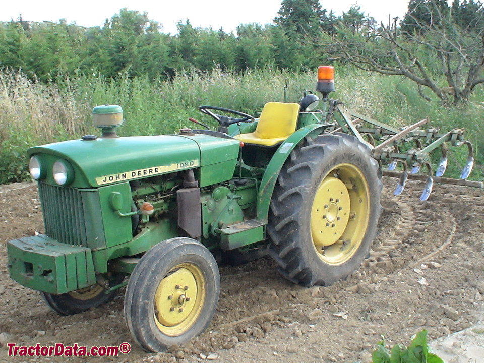 John Deere 1020 VU tractor with cultivator, left side.