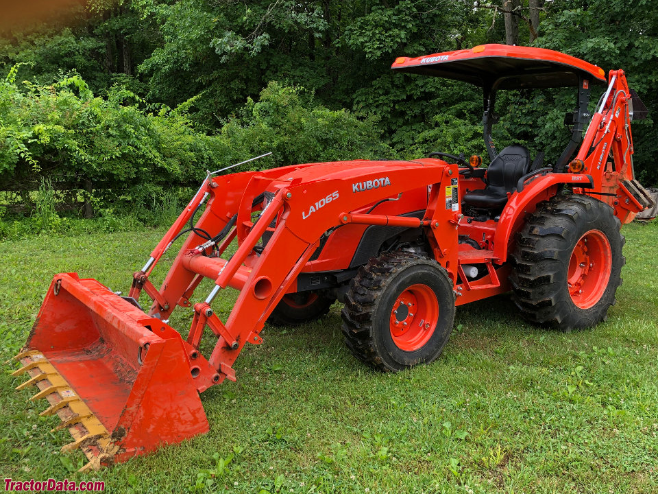 Kubota MX5800 with LA1065 front-end loader and BH92 backhoe.